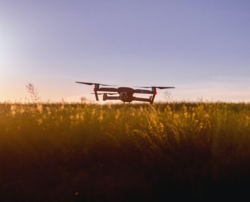 drone-launching-from-field-as-sun-rises