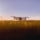 drone-launching-from-field-as-sun-rises