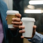 Two-hands-holding-takeaway-cups