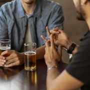 Two-men-talking-over-a-drink-in-the-pub
