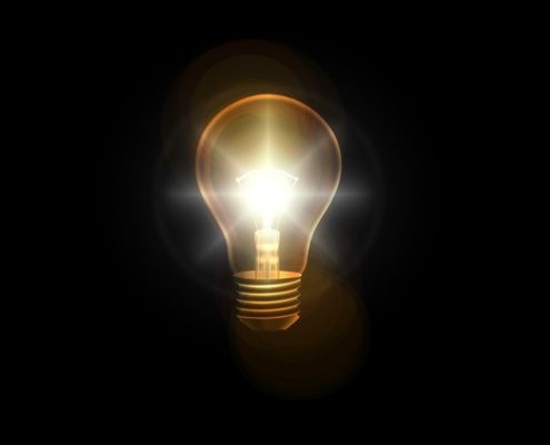 lightbulb-against-black-background