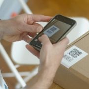 person-scanning-QR-code-on-packaging