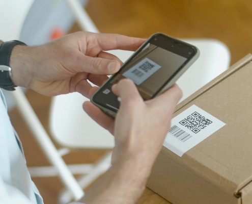 person-scanning-QR-code-on-packaging