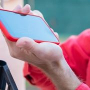 hand-holding-phone-to-scan-for-information