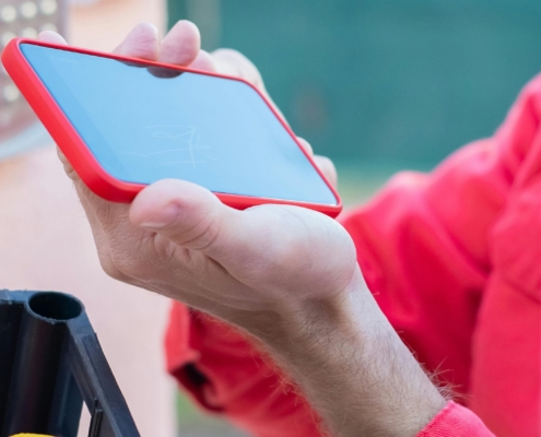 hand-holding-phone-to-scan-for-information