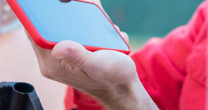 hand-holding-phone-to-scan-for-information