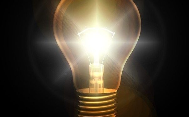 lightbulb-lit-against-dark-background